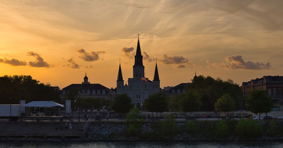 Beautiful sunset view of St. Louis Cathedral and Jackson Square in New Orleans, Louisiana.